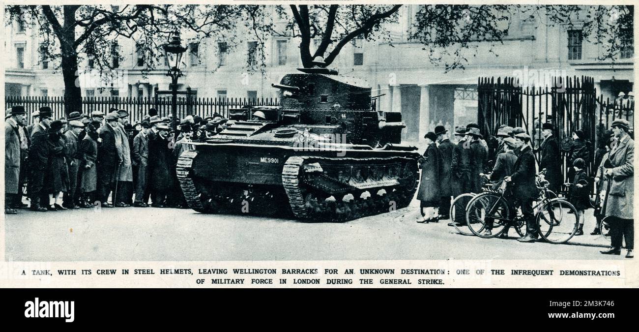 A tank with its crew in steel helmets leaving Wellington Barracks for an unknown destination: one of the infrequent demonstrations of military force in London during the General Strike. In support of a strike by coal miners over the issue of threatened wage cuts, the Trades Union Congress called a General Strike in early May 1926. The strike only involved certain key industrial sectors (docks, electricity, gas, railways) but, in the face of well-organised government emergency measures and lack of real public support, it collapsed after nine days.     Date: 1926 Stock Photo