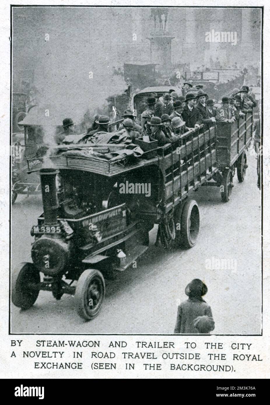 Londoners travelling by a steam-wagon and trailer combination past the Royal Exchange in the City of London during the General Strike.    In support of a strike by coal miners over the issue of threatened wage cuts, the Trades Union Congress called a General Strike in early May 1926. The strike only involved certain key industrial sectors (docks, electricity, gas, railways) but, in the face of well-organised government emergency measures and lack of real public support, it collapsed after nine days.     Date: 1926 Stock Photo