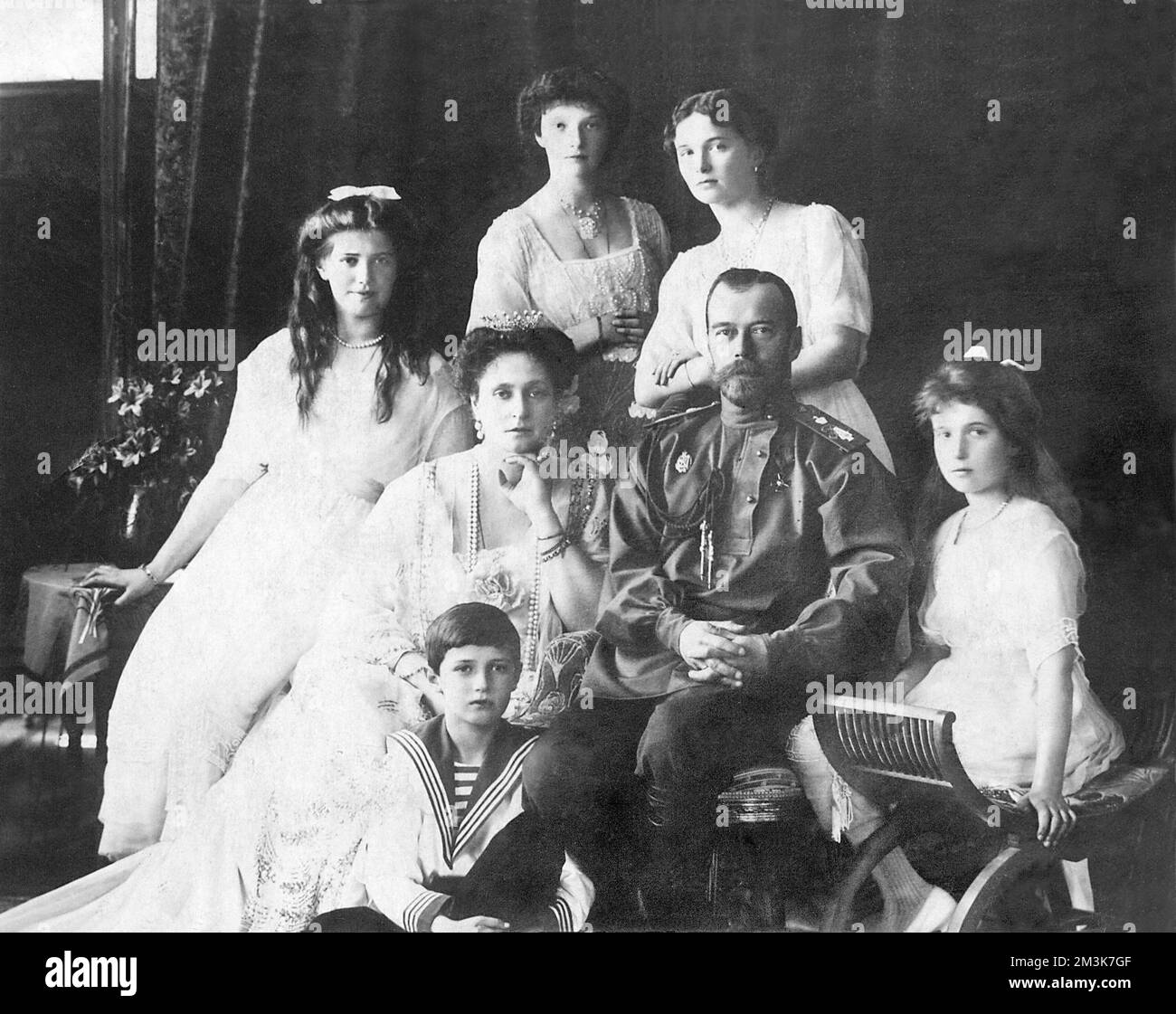 Tsar Nicholas II with his wife Tsaritsa Alexandra Feodorovna and their five children, from left; Maria, Alexei (seated on floor), Olga, Tatiana and Anastasia. Stock Photo