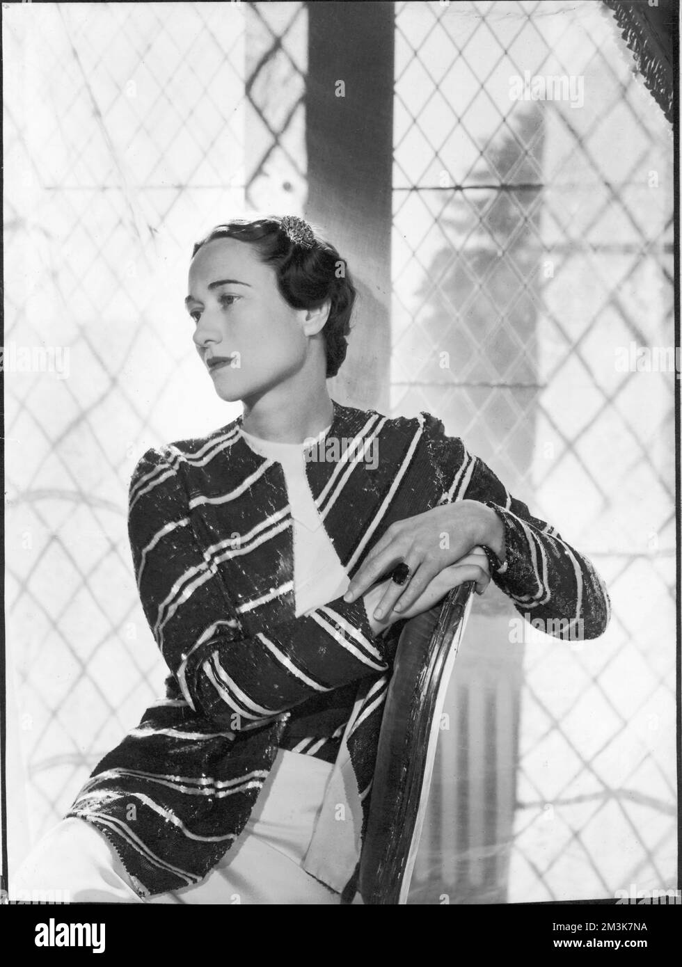 A glamorous studio portrait of Bessie Wallis Warfield Simpson, later Duchess of Windsor (1896-1986), American socialite.  Born in Blue Ridge  Summit, Pennsylvania, she divorced her second husband, Ernest Simpson in order to marry Edward VIII who abdicated the throne in December 1936 to marry her.     Date: 1936 Stock Photo