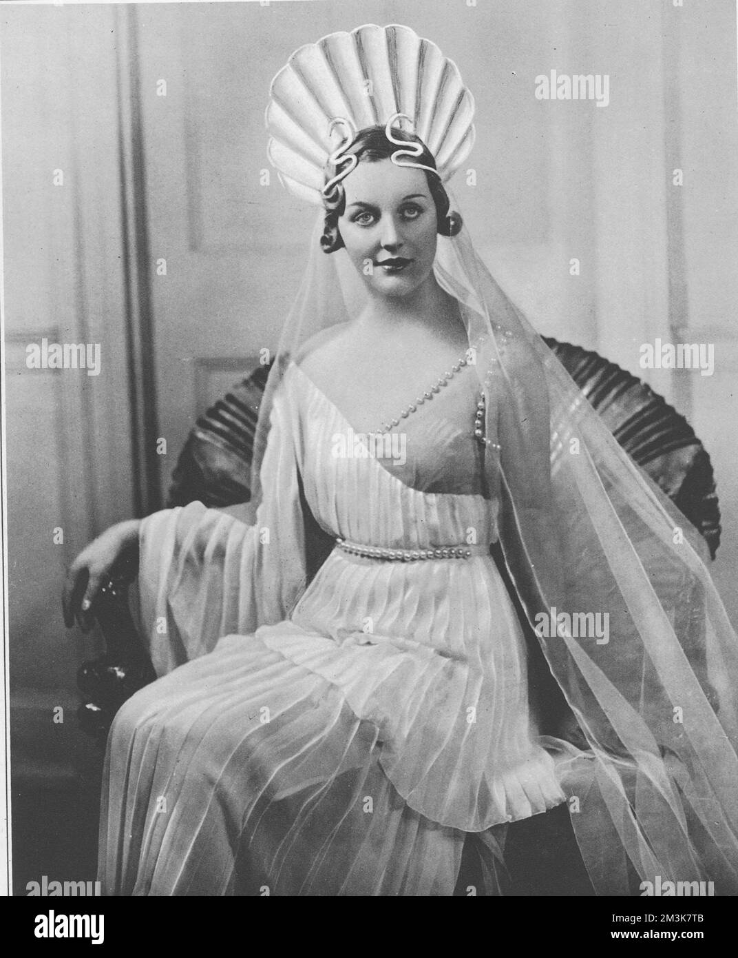 Front cover photograph from The Sketch of the Hon. Mrs. Bryan Guinness, formerly the Hon. Diana Mitford, cast as the role of Venus at the Olympian Party and Ball on March 5th 1935 in aid of the Greater London Fund for the Blind.     Date: 6th March 1935 Stock Photo