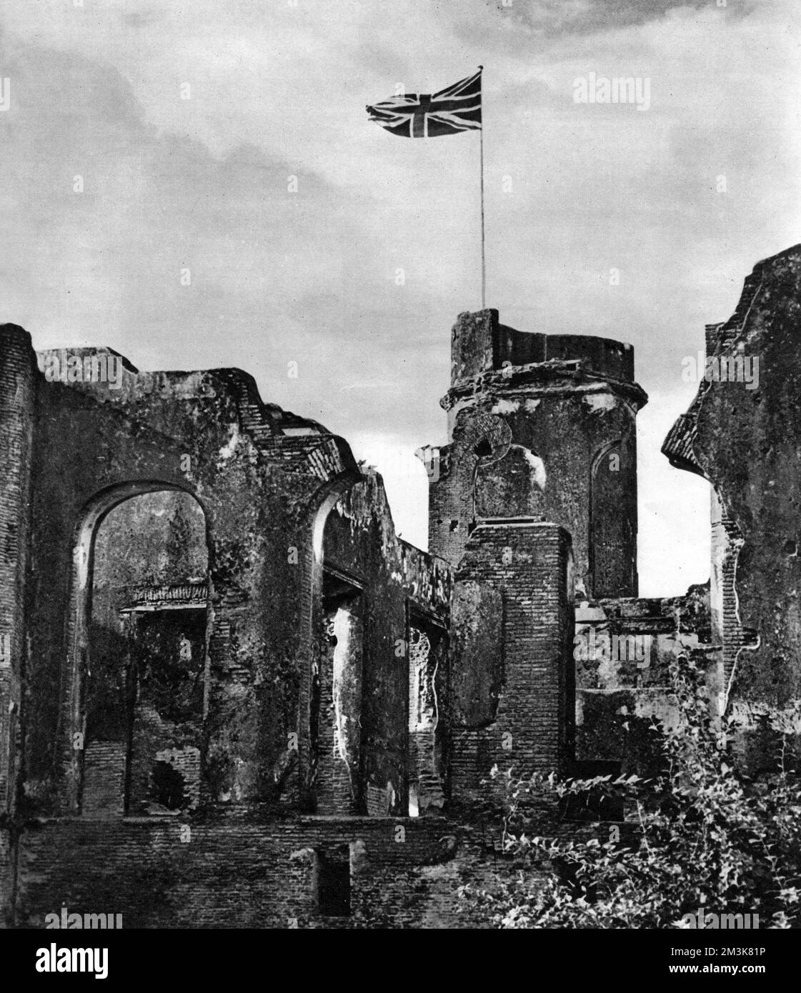 On 15 August, 1947, British India ended and the two new Dominions of India and Pakistan came into being under Independence.  New flags were raised at the new capitals, Delhi and Karachi respectively.  On this day the flag over the ruins of Lucknow Residency was lowered for the first and last time, since 1858 - the year in which direct British rule in India replaced that of the British East India Company following the Indian Mutiny, or Sepoy Rebellion, of 1857-1858.     Date: 23/08/1947 Stock Photo
