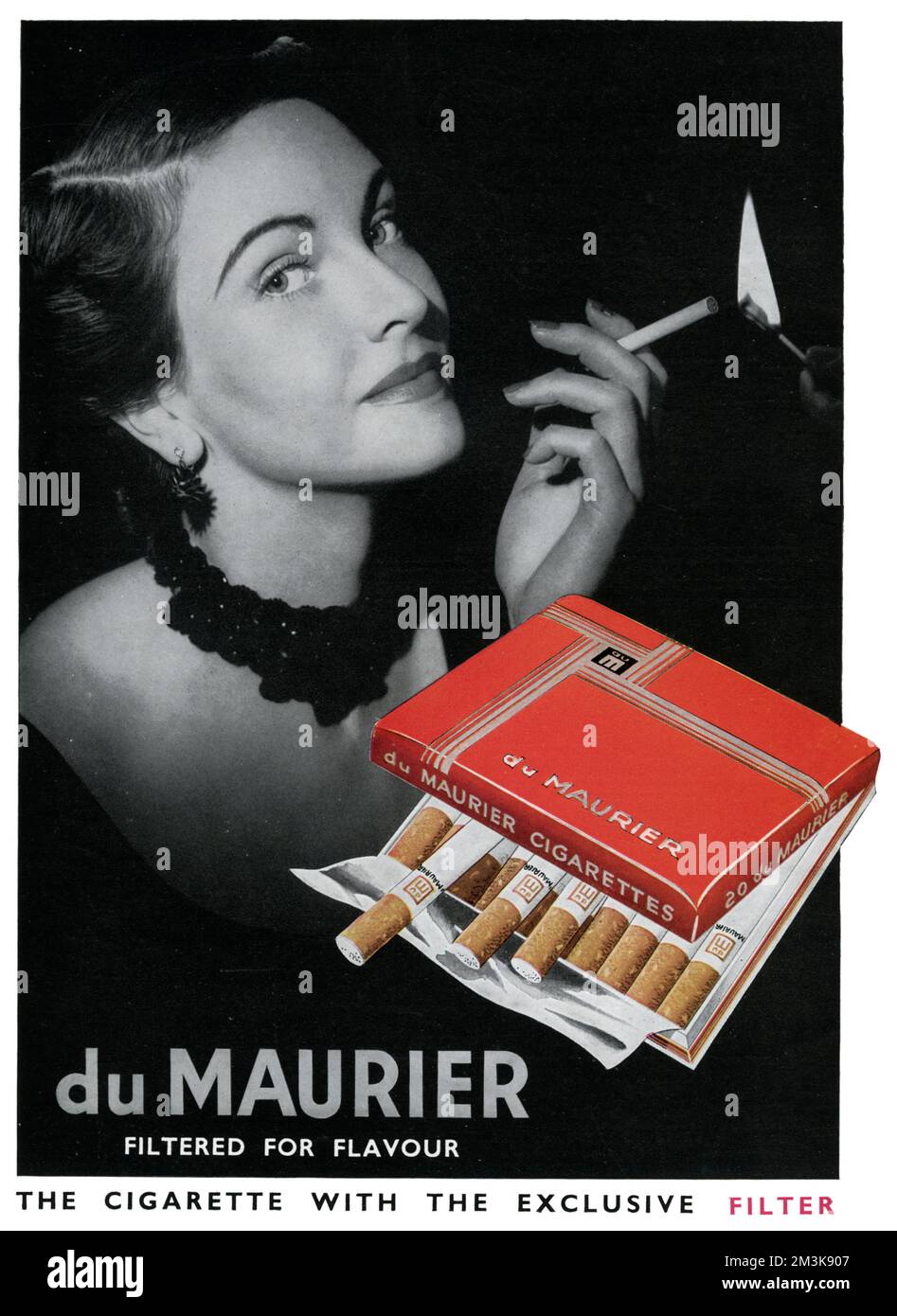 Advertisement for du Maurier cigarettes, the cigarette with the exclusive filter (whatever that is).  Clearly, the elegant woman who is procuring a light from an unseen admirer seems to think they're rather good!     Date: 1951 Stock Photo