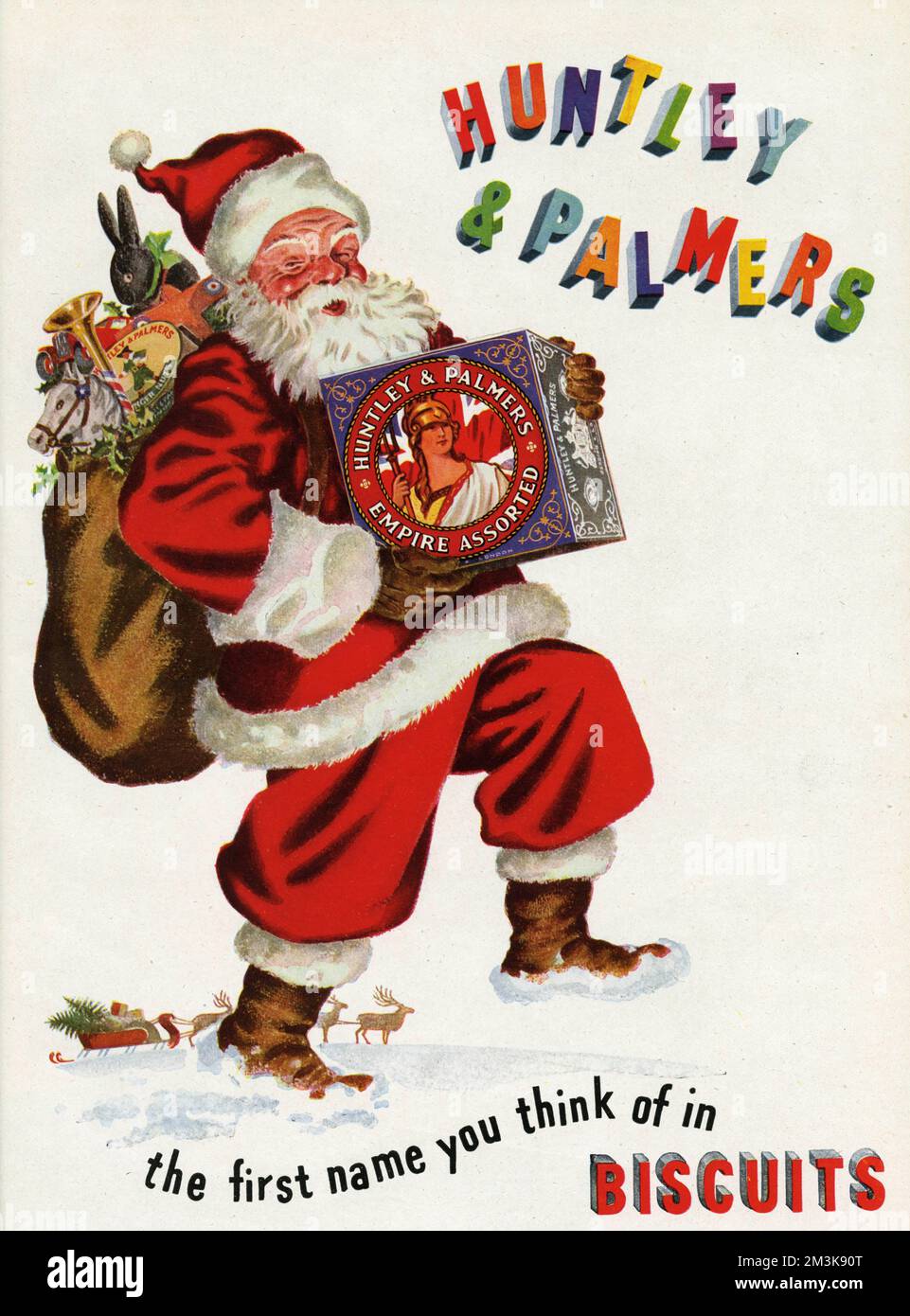 Huntley and Palmers biscuits advertisement with Father Christmas holding a box of Empire Assorted biscuits     Date: 1947 Stock Photo