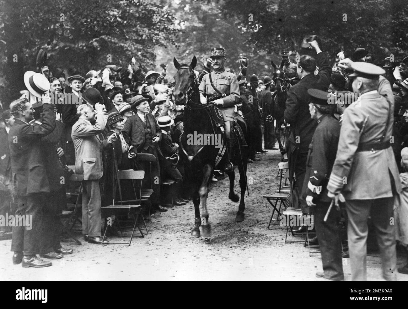 Victory march of Marshal Ferdinand Foch and General Maxime Weygand in Hyde Park, cheered on by the crowds      Date: C.1918 Stock Photo