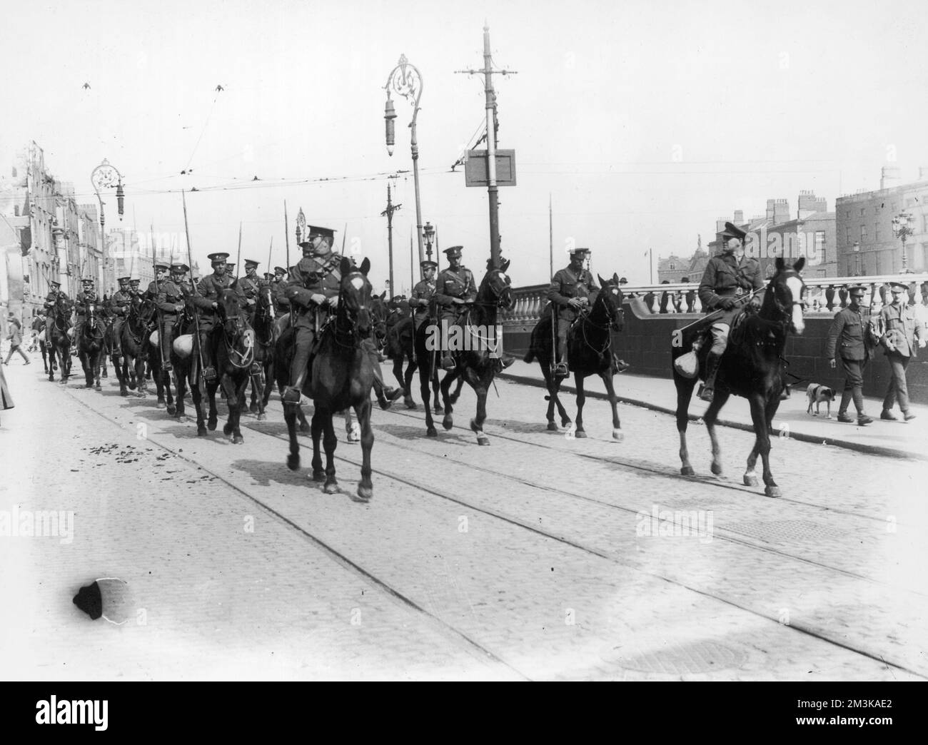Ulster Volunteers ride on horseback through the streets of Dublin during the Easter rising of April 1916.       Date: 1916 Stock Photo