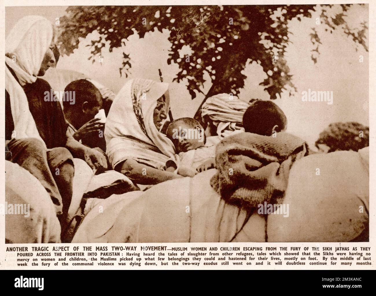 Muslim women and children escaping the Sikh Jathas, pouring over the frontier border into Pakistan having heard about atrocities and violence following Partition in 1947.  1947 Stock Photo