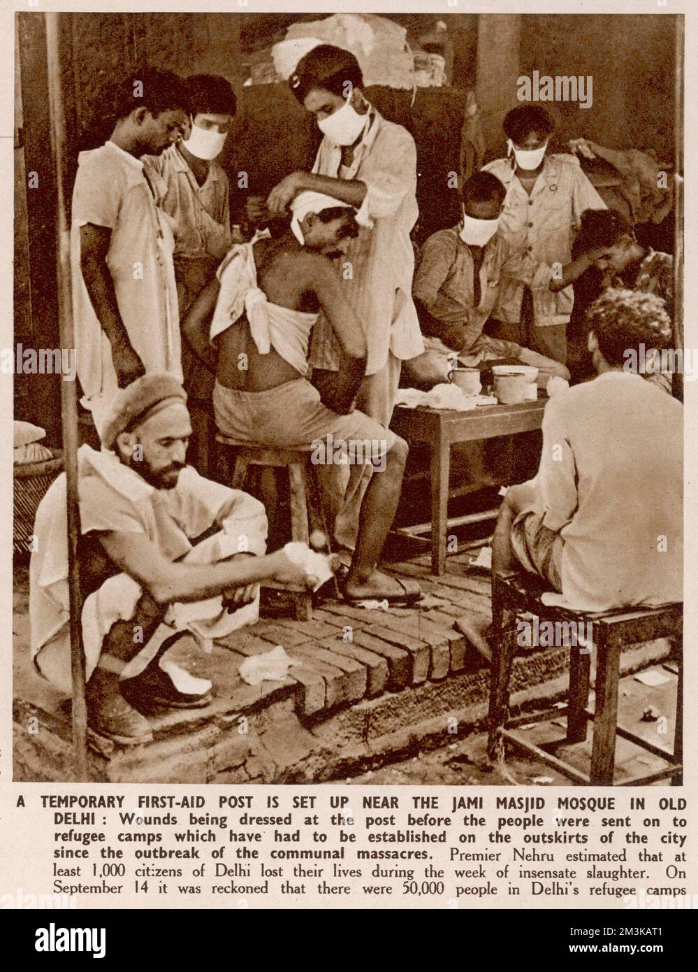 Wounds being dressed at the post before the people were sent on to refugee camps which have had to be established on the outskirts of the city since the outbreak of communcal massacres, part of the widespread violence between Hindus, Sikhs and Muslims following partition and the creation of modern India and Pakistan.  1947 Stock Photo