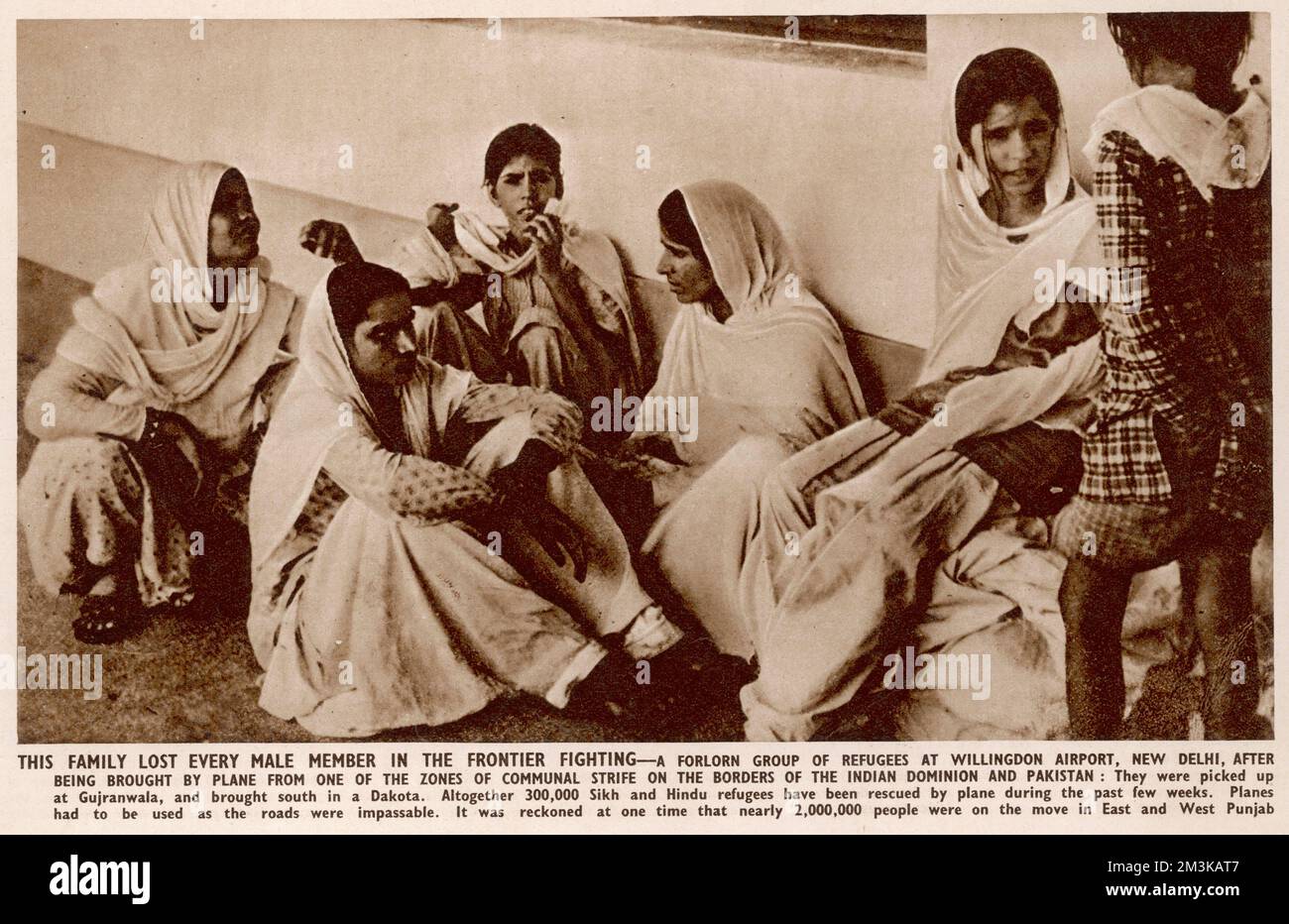 A family who lost every male member in the frontier fighting - a forlorn group of refugees at Willingdon airport, New Delhi, after being brought by plane from one of the zones of communal strife on the borders of India and Pakistan.  They were picked up at Gujranwala and brought south in a Dakota.  Altogether 300,000 Sikh and Hindu refugees were rescued by plane in September 1947, as roads were impassable with an estimated two million people on the move in East and West Punjab.    1947 Stock Photo