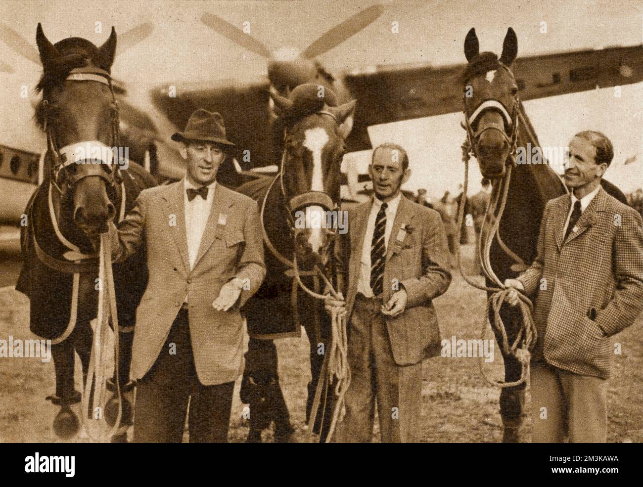 Britain's only victory in the XVth Olympic Games in Helsinki: the winners of the team showjumping gold medal (from l to r) Colonel H.M. Llewellyn, with Foxhunter; Mr W. White, with Nizefella; and Lt-Colonel D.N. Stewart, with Aherlow on their return to Britain.  1952 Stock Photo