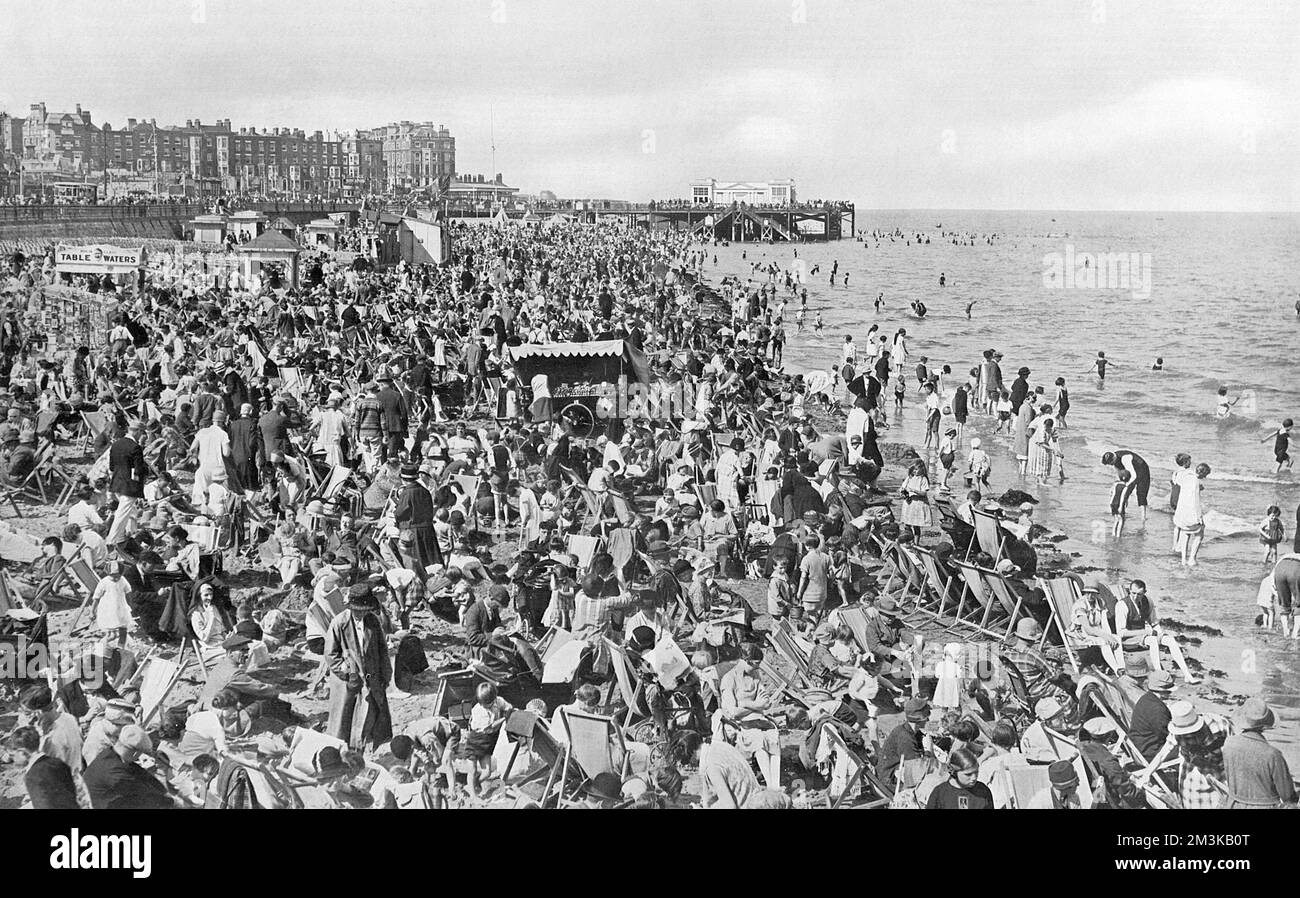 Thousands of holiday makers enjoy the pleasures of the beach at Margate during warm and sunny weather at the end of August, 1927.  1927 Stock Photo