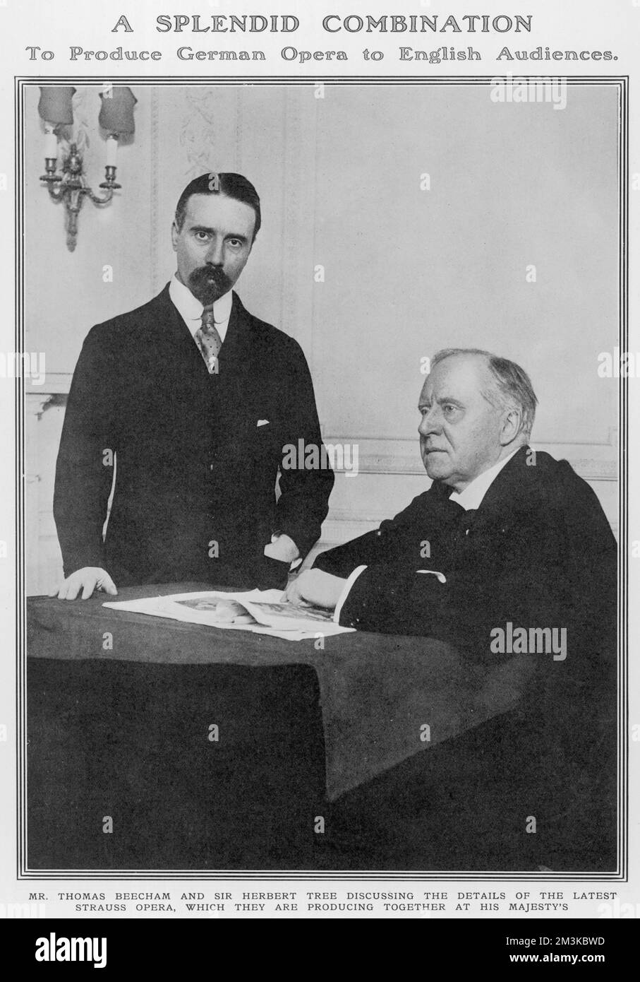 The English Actor-Manager Herbert Beerbohm Tree (seated), pictured with Sir Thomas Beecham, English conductor and impresario together in Tree's study at His Majesty's Theatre in London.  The pair collaborated in 1913 on Somerset Maugham's adaption of a play by Moliere, 'Le Bougeois Gentilhomme' and Dr Richard Strauss's opera, 'Ariadne auf Naxos'.       Date: 1913 Stock Photo