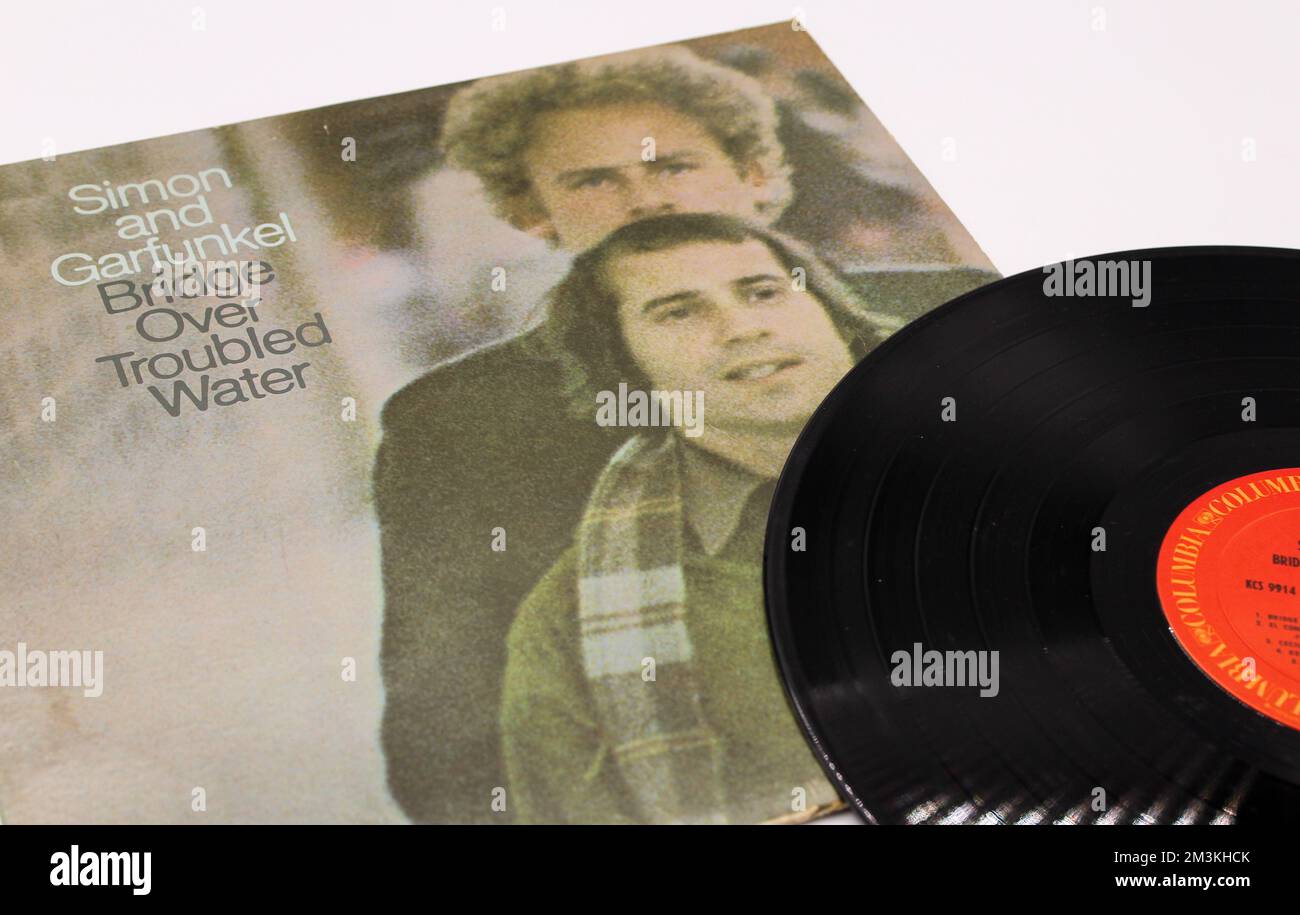 Folk rock singers, Simon and Garfunkel, music album on vinyl record LP disc titled bridge over troubled water. Paul Simon and Art Garfunkel album cove Stock Photo