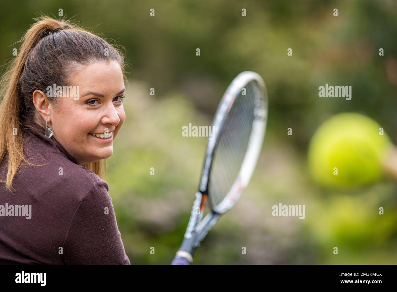 female athlete hitting tennis balls. woman playing social tennis in