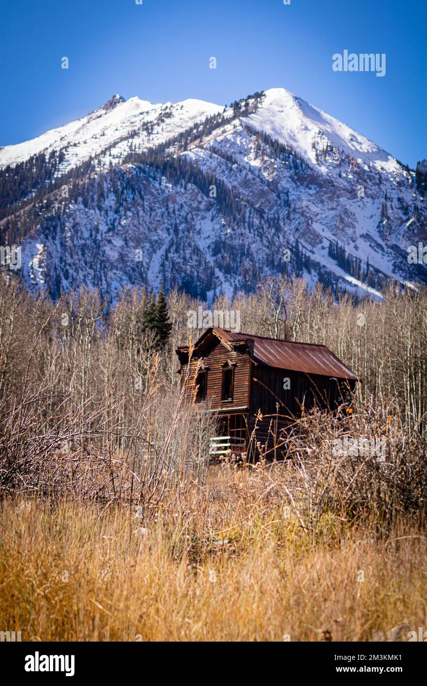 Sitting desolate near Aspen, Colorado one can find an old western ghost town, Ashcroft.  The grasslands surrounding the peaks are lonely yet stoic. Stock Photo