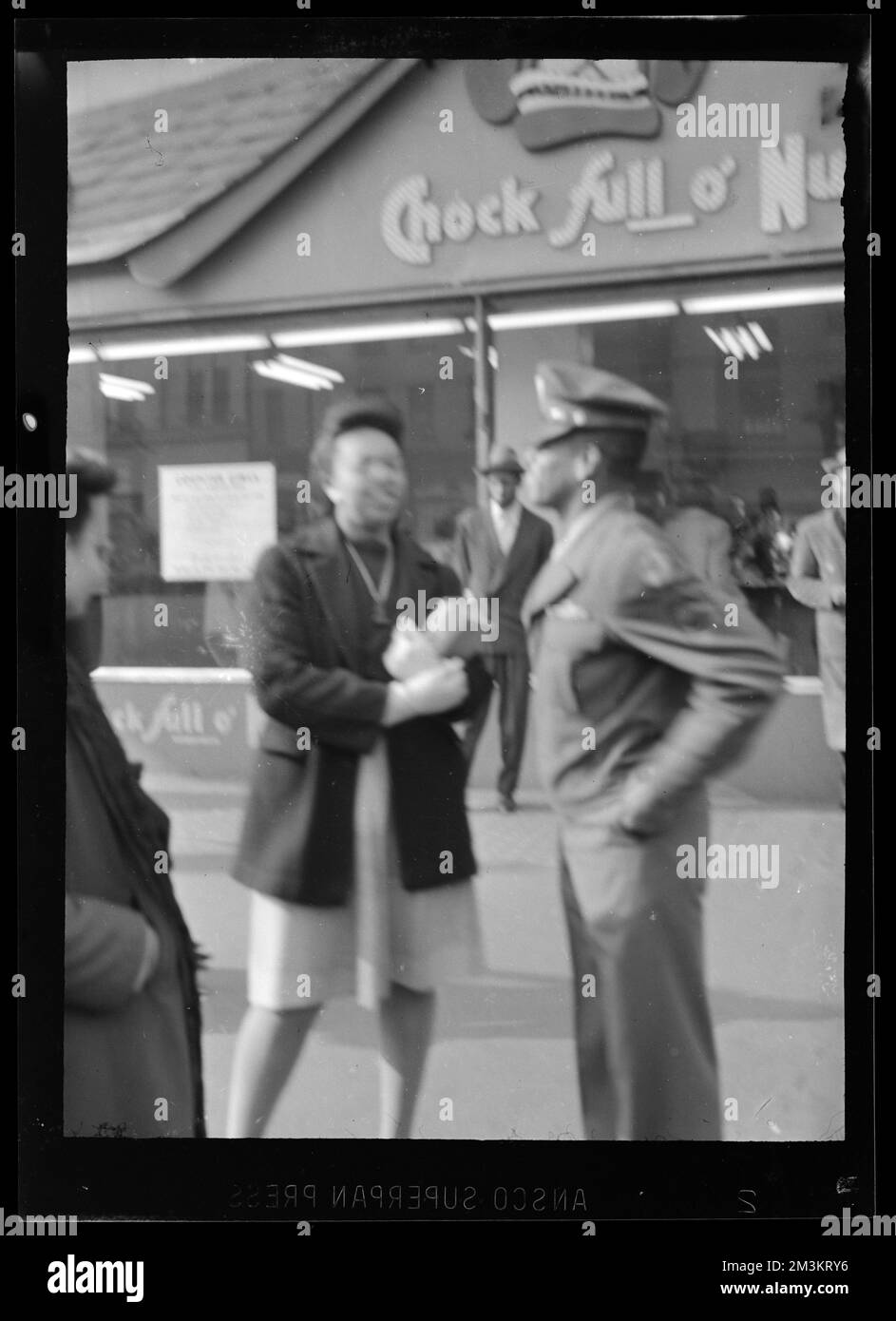 People stand outside of a Chock Full o' Nuts coffee shop , Cafes. Jack