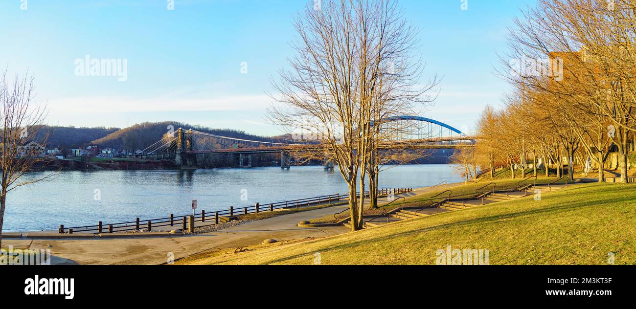 Ohio River panorama with Wheeling Suspension and Fort Henry bridges.You can see Ohio across the river, taken from Heritage Port waterfront park, Wheel Stock Photo