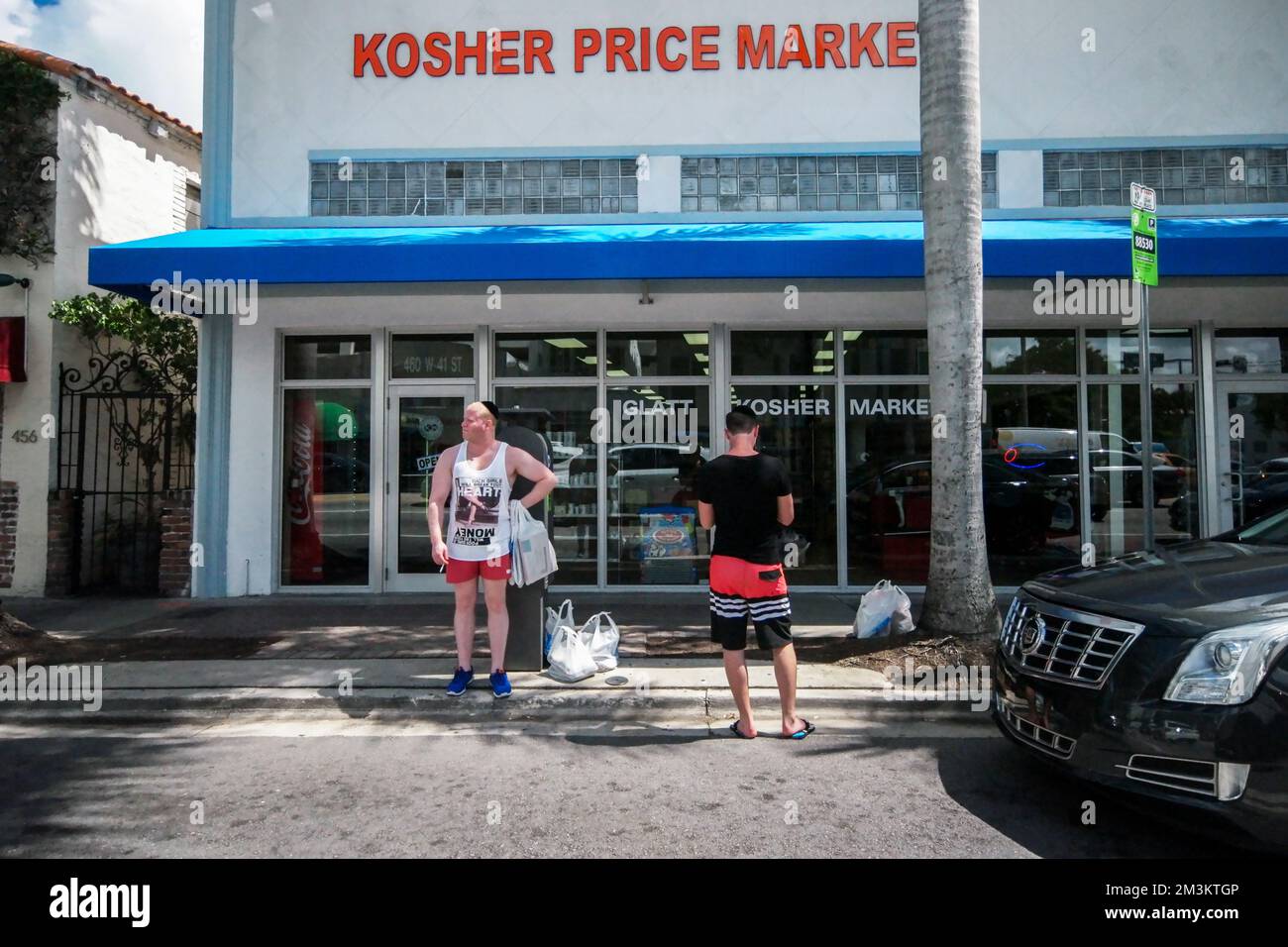 hanging out in front of the kosher market waiting on ride Stock Photo