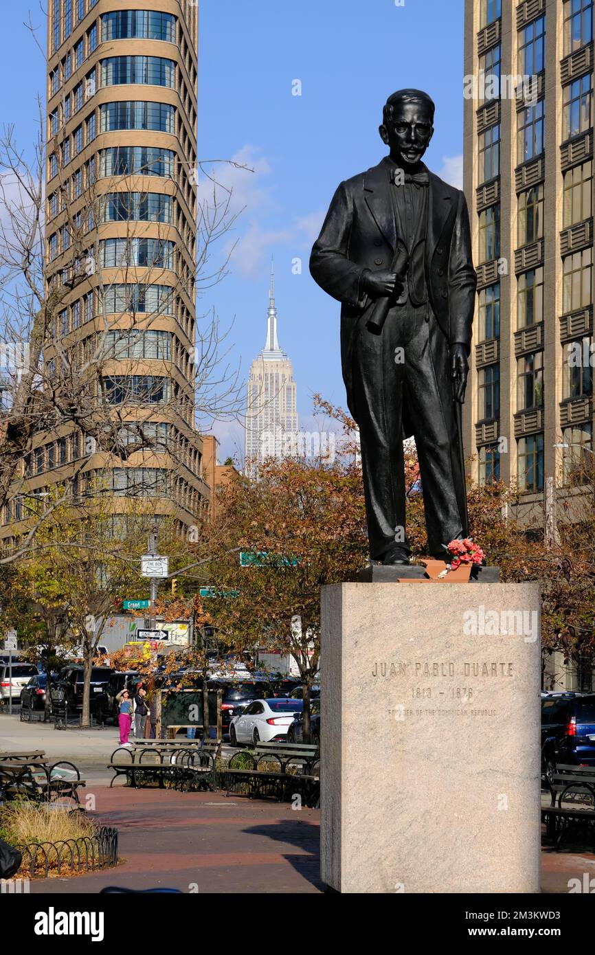 The statue of Juan Pablo Duarte 1813-1876 the founder of Dominican Republic in Duarte Square with Empire State Building in the background.Lower Manhattan.New York City.USA Stock Photo