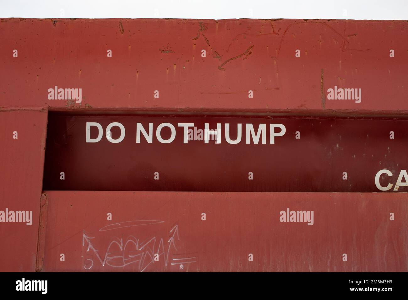 Detail "Do Not Hump" signage on the side of a HydraDump railroad dump
