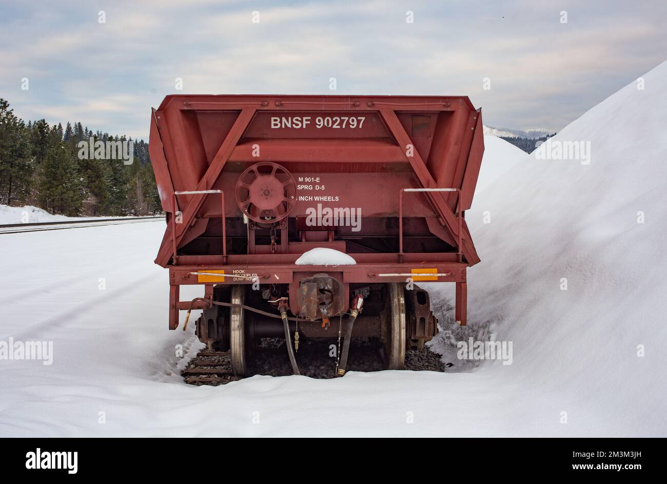 A railroad dump car on the tracks at the BNSF train yard, in the town