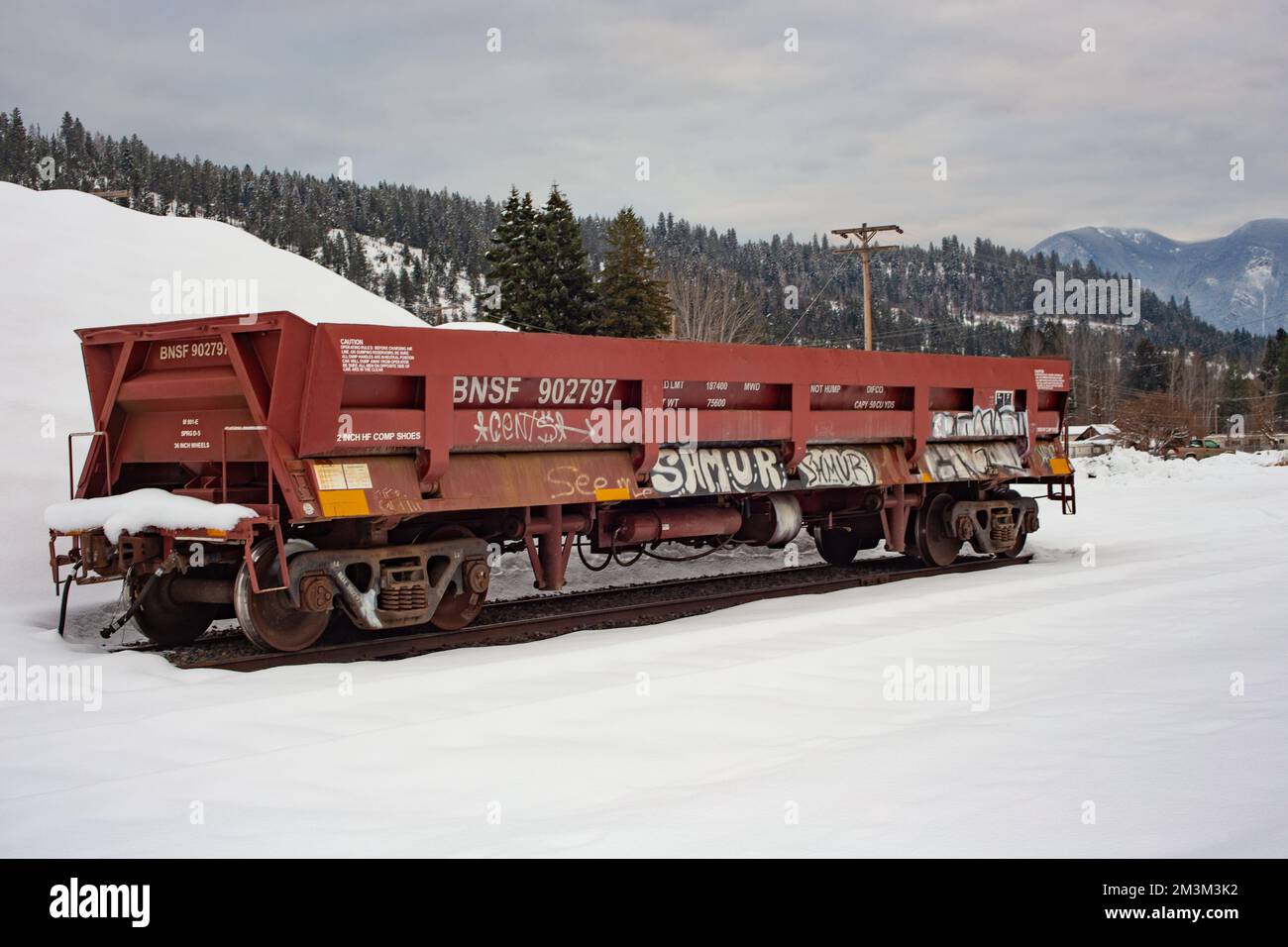 A railroad dump car on the tracks at the BNSF train yard, in the town