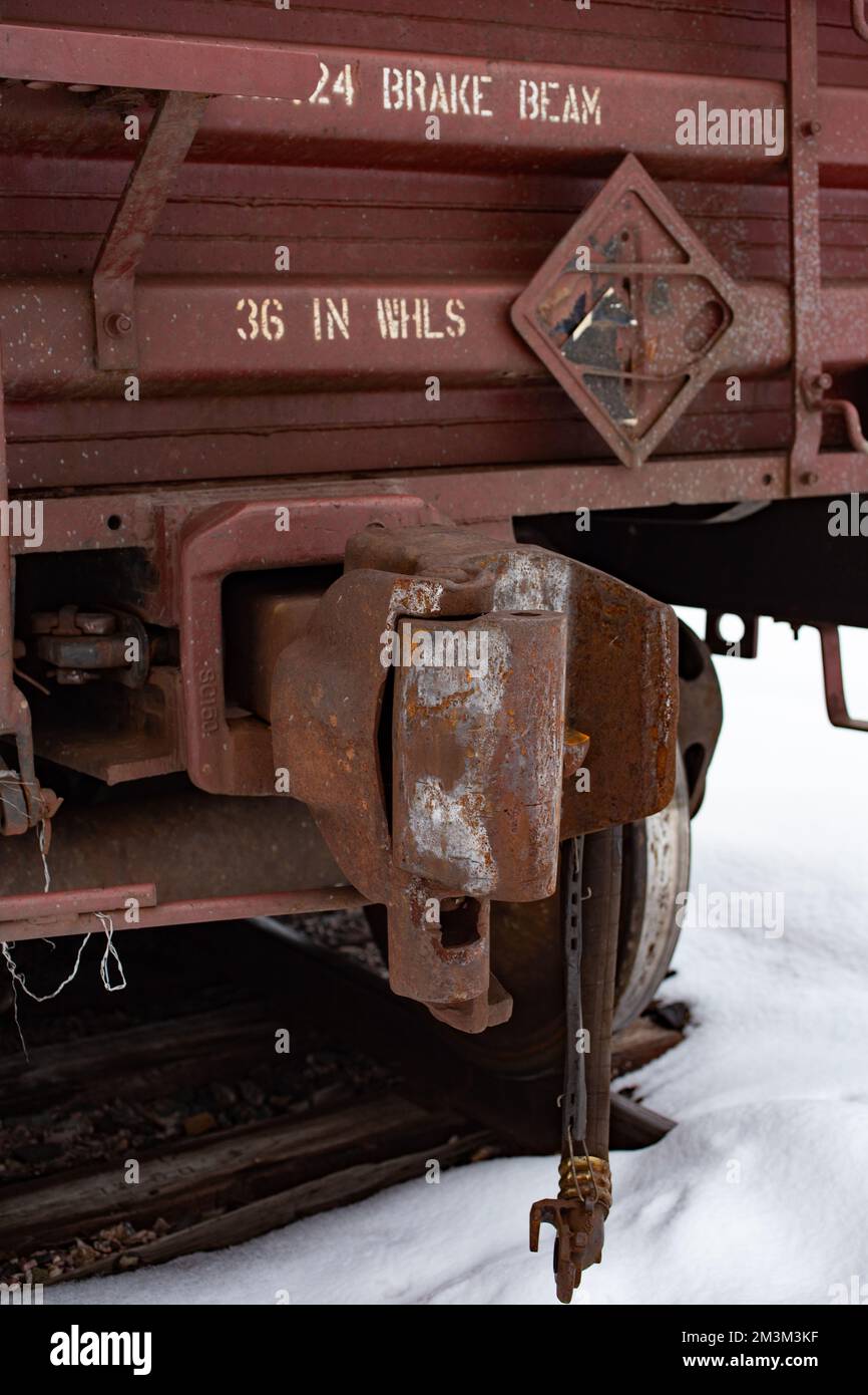 A coupler on a railroad gondola car on the tracks at the BNSF train