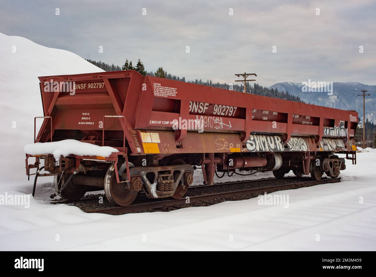 A railroad dump car on the tracks at the BNSF train yard, in the town