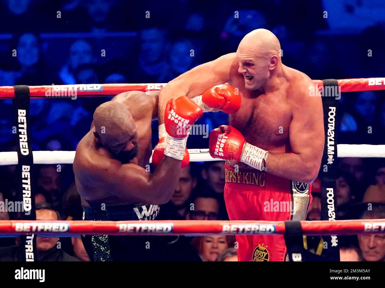 File photo dated 03-12-2022 of Tyson Fury (right) in action against Derek Chisora. Tyson Fury defended his WBC heavyweight world title with a 10th-round stoppage of old rival Derek Chisora to stay on course for a unification showdown with reigning IBF, IBO, WBO and WBA holder Oleksandr Usyk, who was ringside at the Tottenham Hotspur Stadium. Issue date: Friday December 16, 2022. Stock Photo