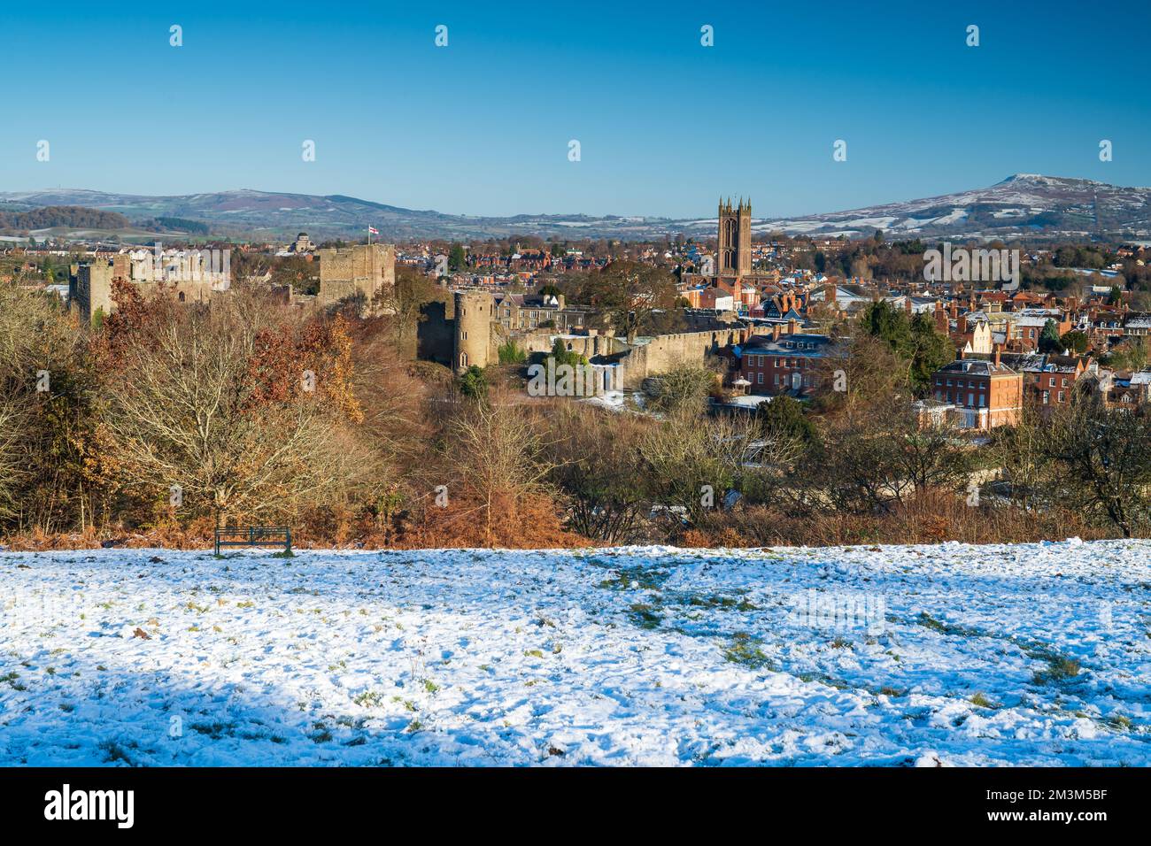 Ludlow Castle and town in Shropshire, UK on a blue sky winters day