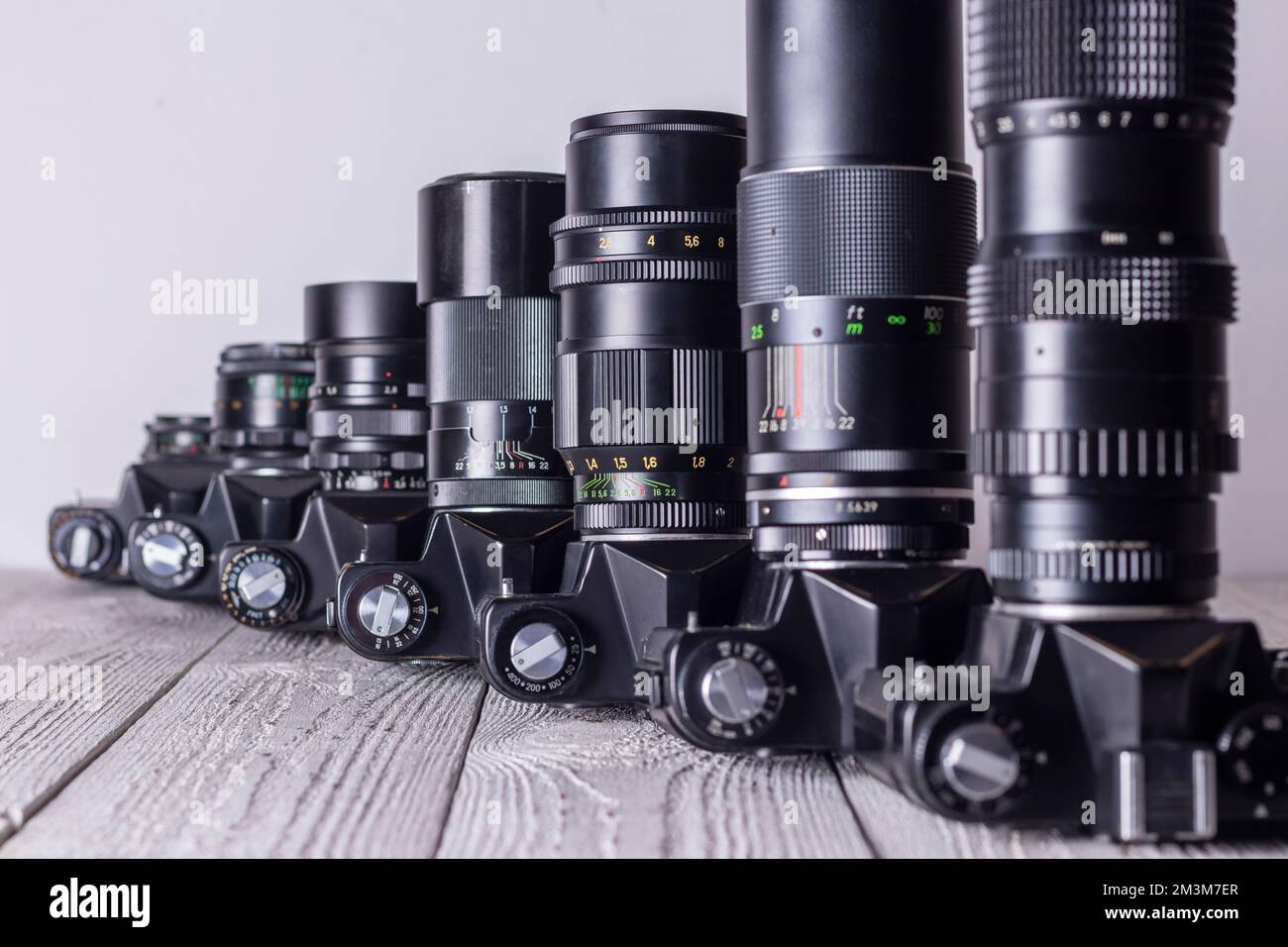 Old retro cameras with different lenses. Perspective Stock Photo Alamy