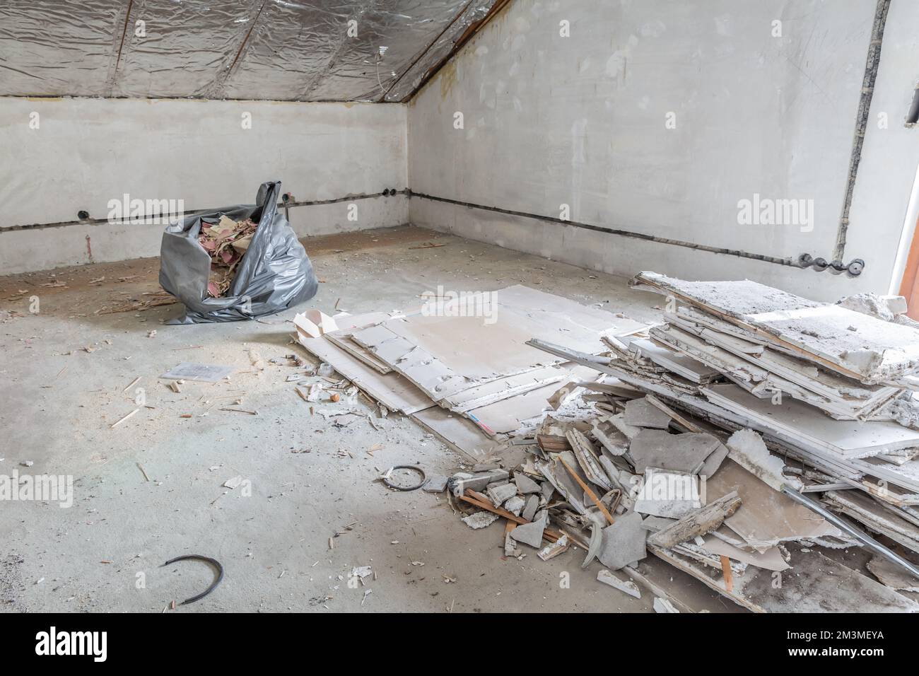 Renovation of old house, room under construction with rubble, old ceiling Stock Photo