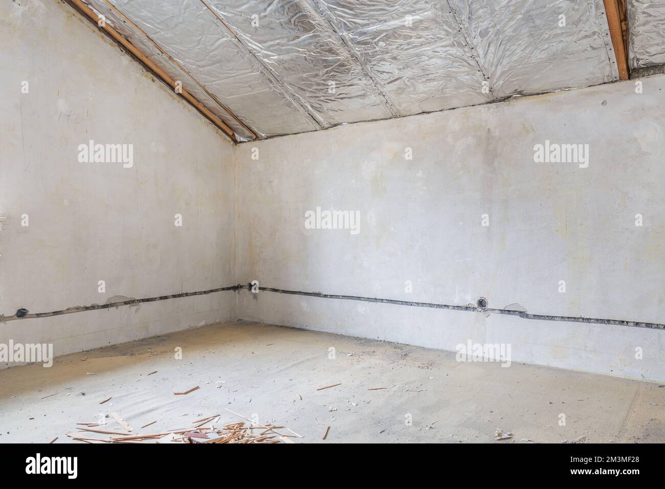 Renovation of old house, room under construction with rubble, old ceiling Stock Photo