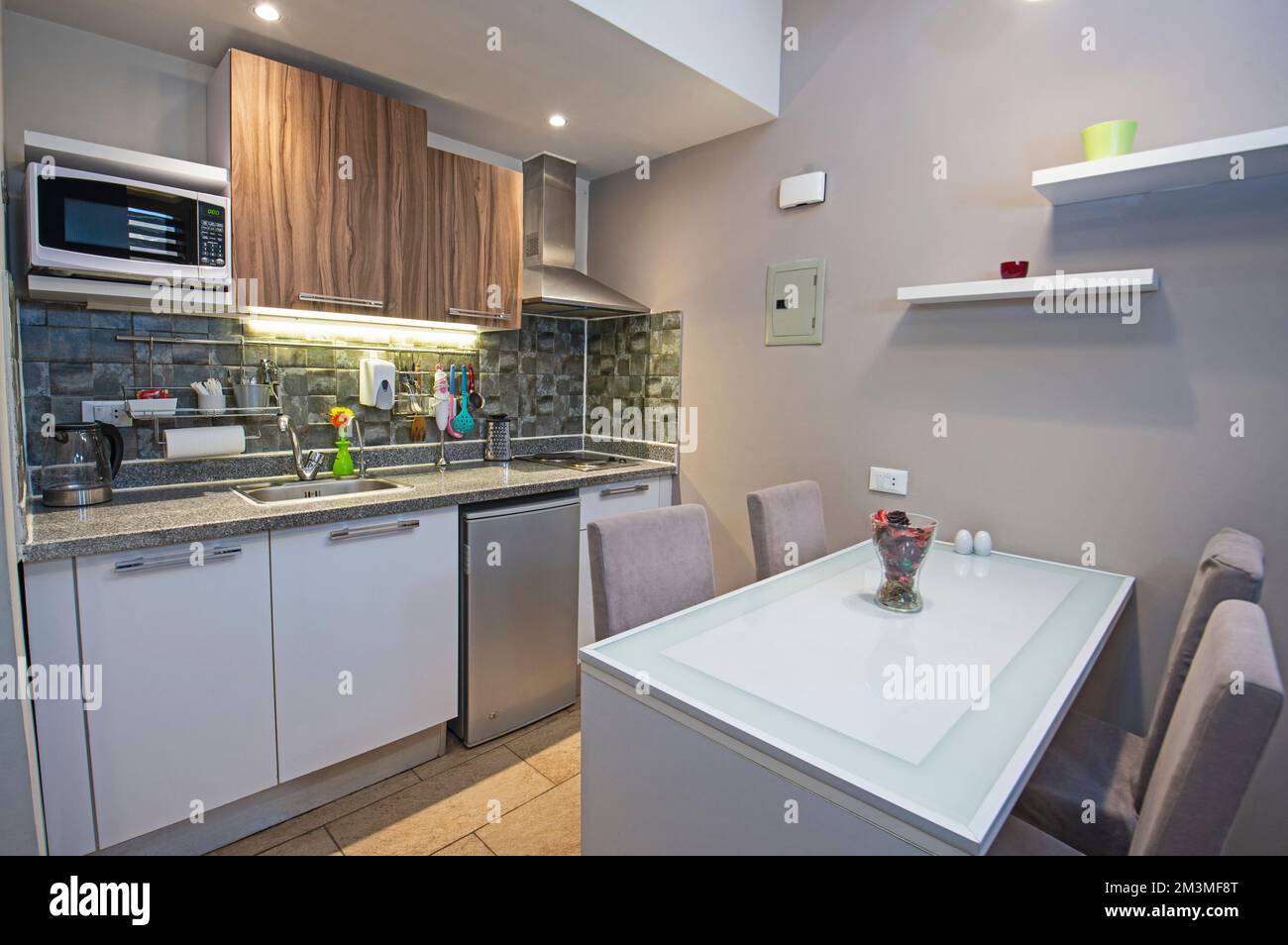 Image showcasing Kitchen area in luxury apartment show home showing interior design ...