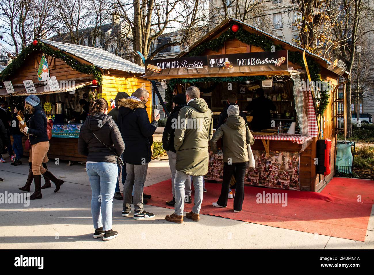 People visiting the Christmas Market in Reims will take place from December 1 to 30, 2022. On the Promenades Jean-Louis Schneiter, the 150 chalets of Stock Photo