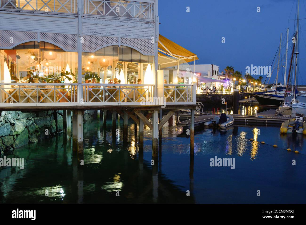 Restaurants in the marina of Playa Grande at dusk Stock Photo