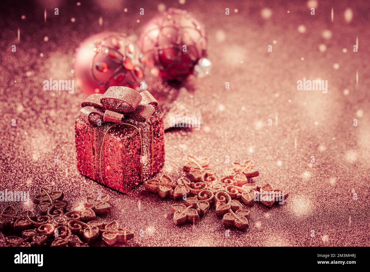 Christmas Present with ornaments and balls. Blurry glitter  background. Stock Photo