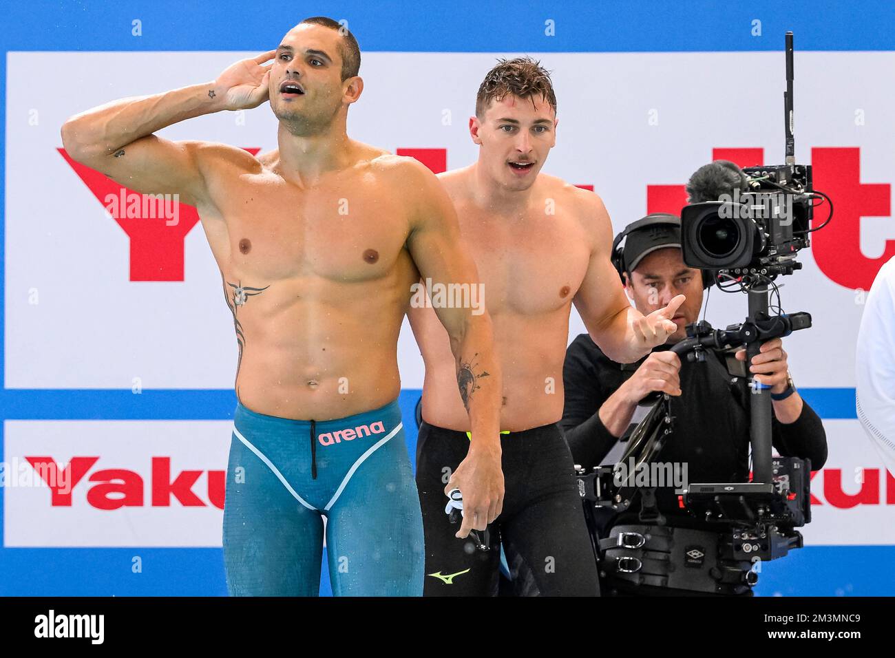 Melbourne, Australia. 16th Dec, 2022. Florent Manaudou and Maxime Grousset  of France celebrate after winning the gold medal in the 4x50m Freestyle  Relay Mixed Final with a new world record during the
