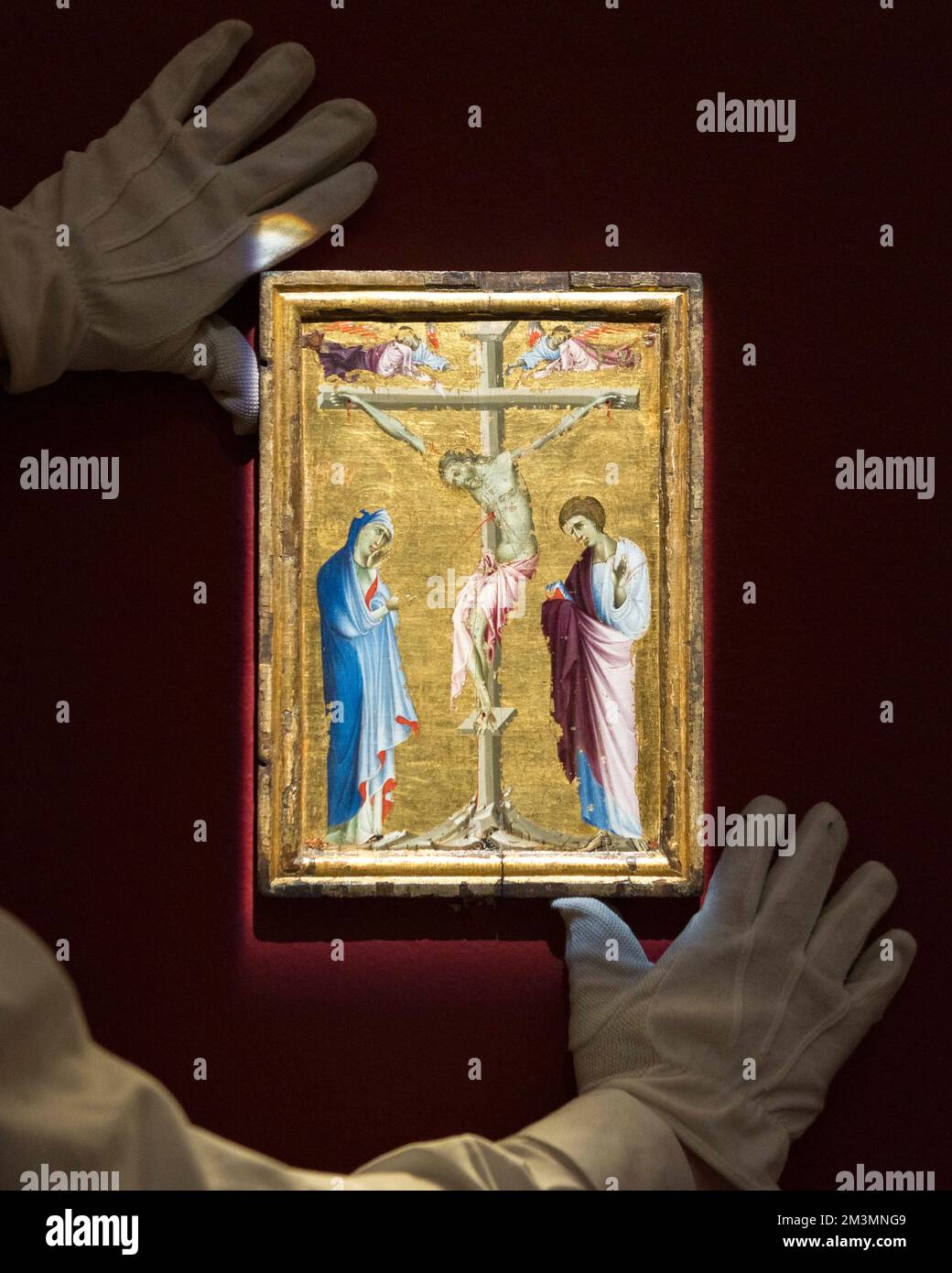 Bolognese School, 13th Century, Crucifixion with the Virgin, Saint John the Evangelist, and two grieving angels, tempera on panel, gold ground, goes o Stock Photo