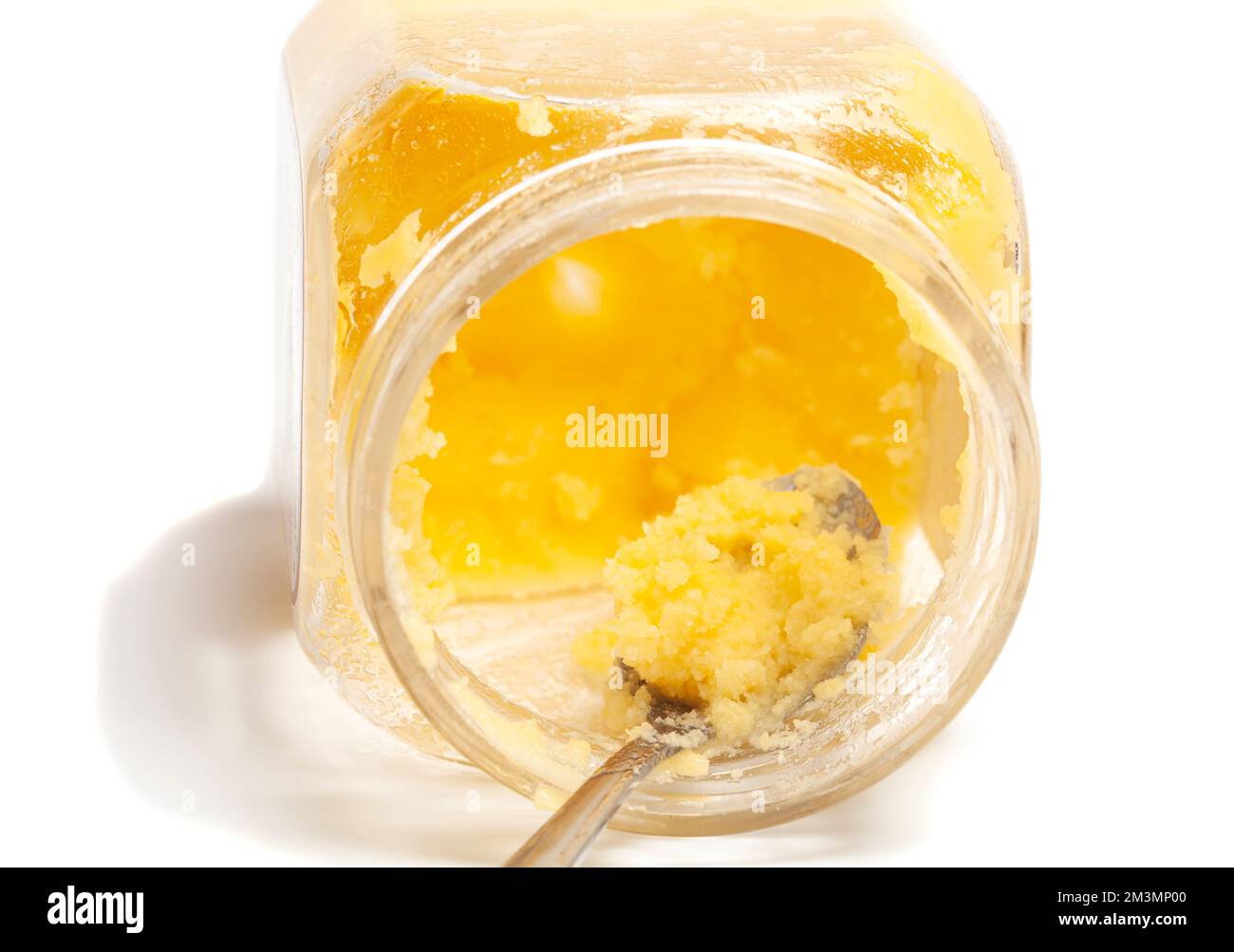 Ghee in jar and spoon isolated on white background Stock Photo Alamy