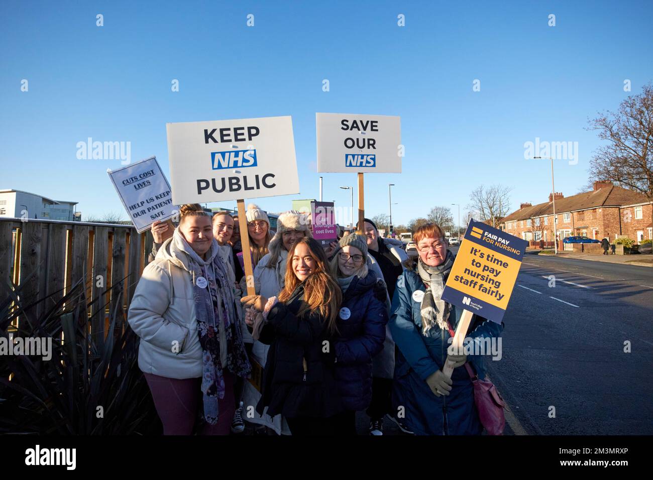 Nurses holding up placards on the picket line during strike day outside aintree university