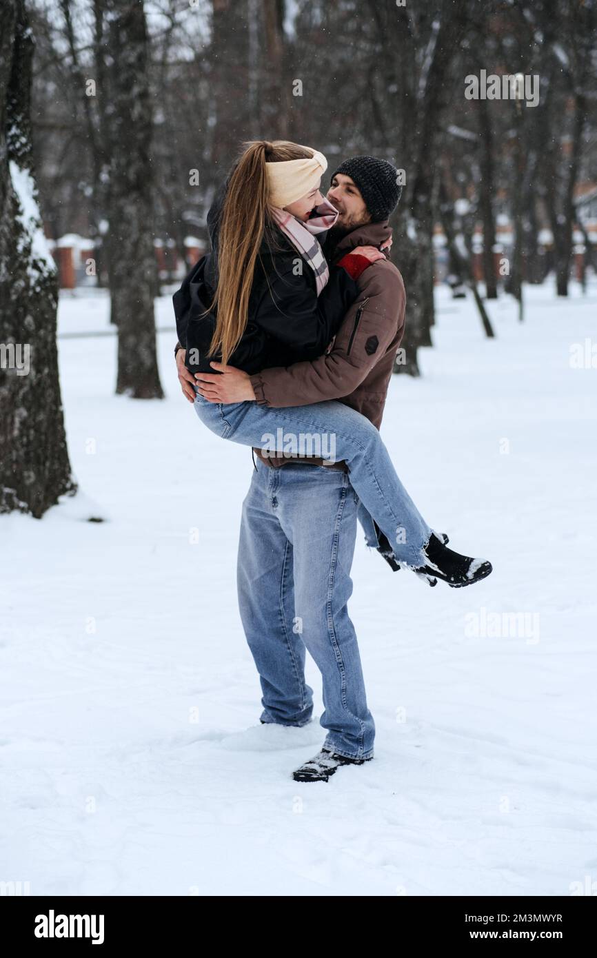 Outdoors winter dates for couples, winter love story. Cold season