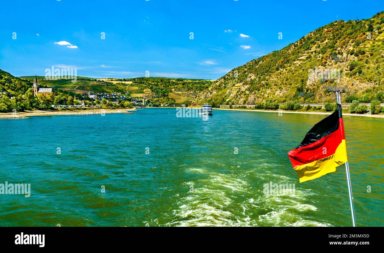 German Flag on a cruise boat in the Rhine Gorge. UNESCO world heritage ...