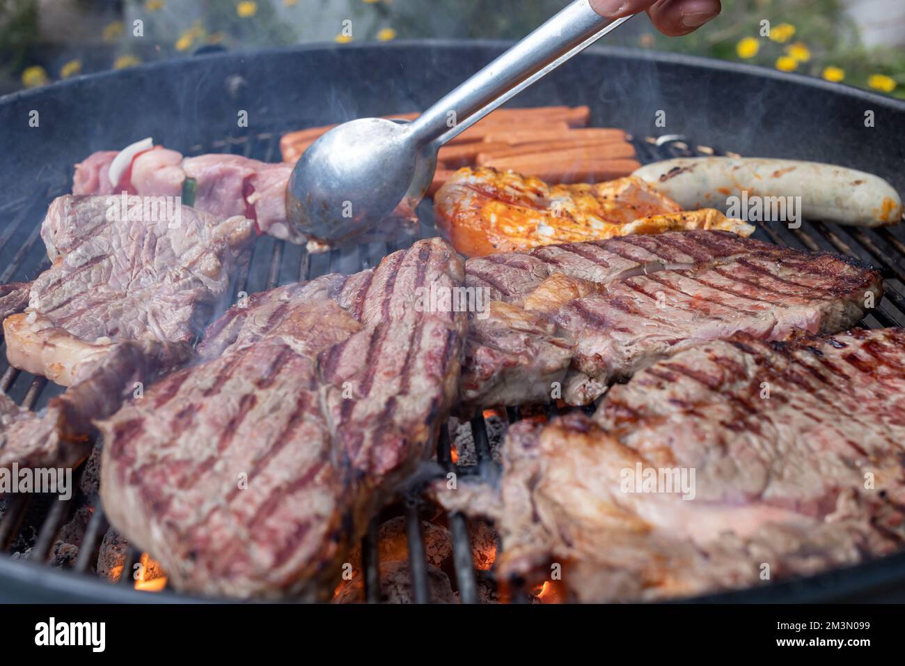 steaks and sausages on the charcoal grill Stock Photo Alamy