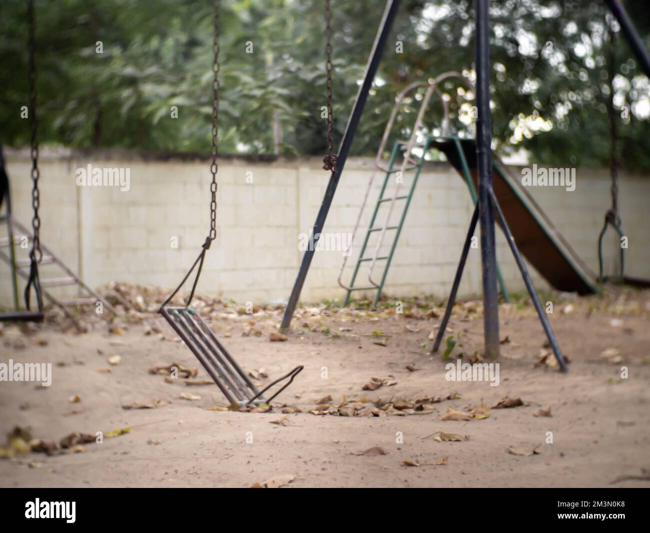 One side of the broken iron swing Stock Photo