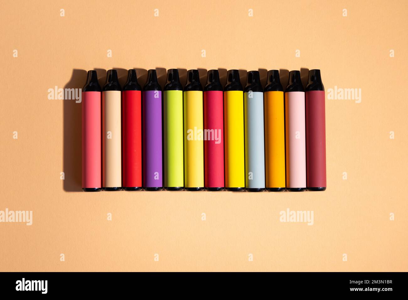 Assortment of disposable ecigarettes on a light background. Nicotine