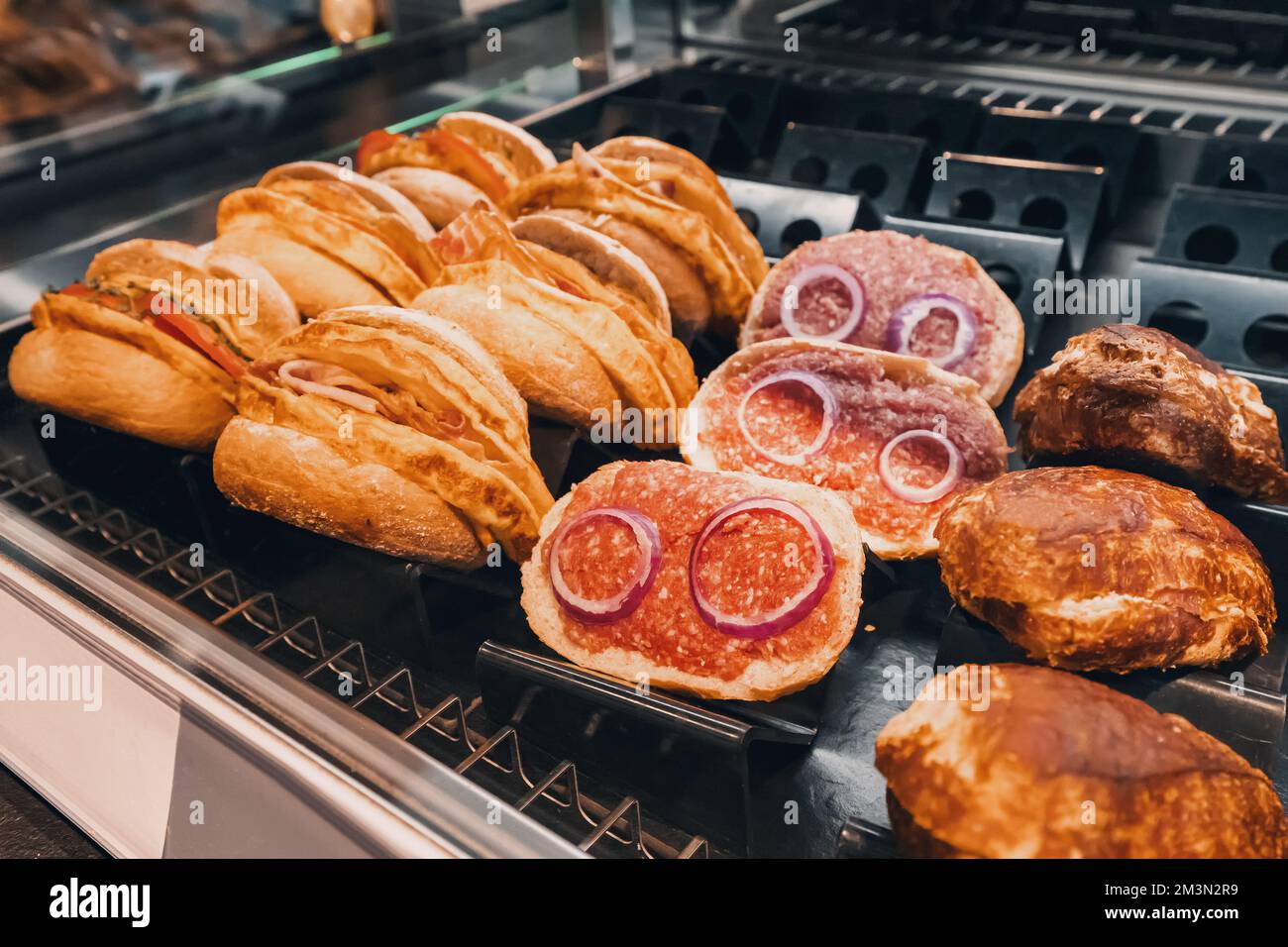 Traditional in german cuisine - mett sandwich with minced meat and onions for sale on a shelf of supermarket or fastfood cafe Stock Photo