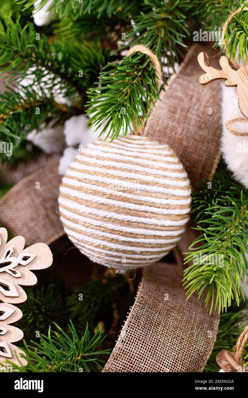 Natural Christmas tree ornament bauble made from beige and white jute rope Stock Photo