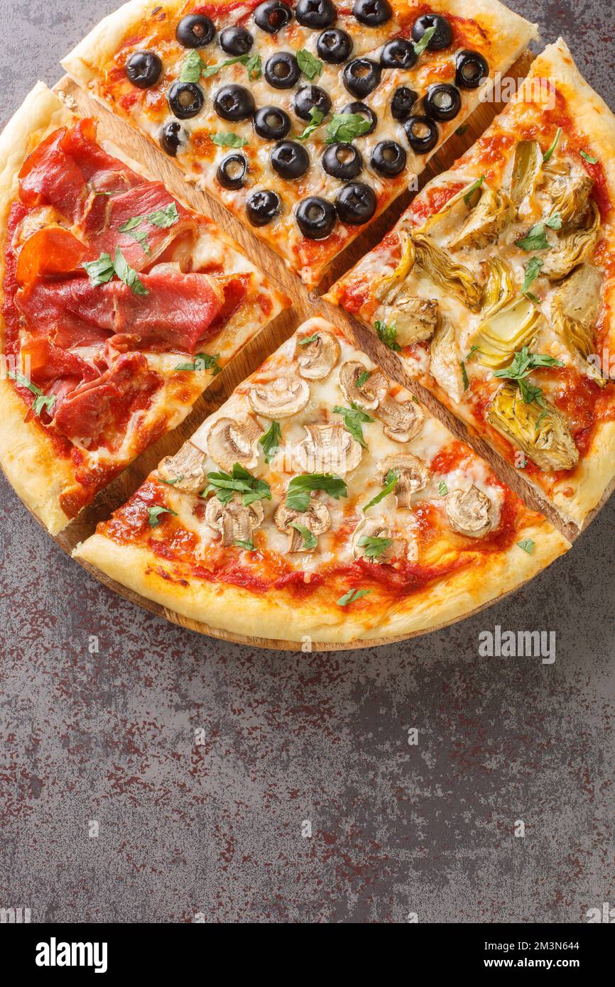 four seasons pizza quattro stagioni made with tomato sauce, mozzarella