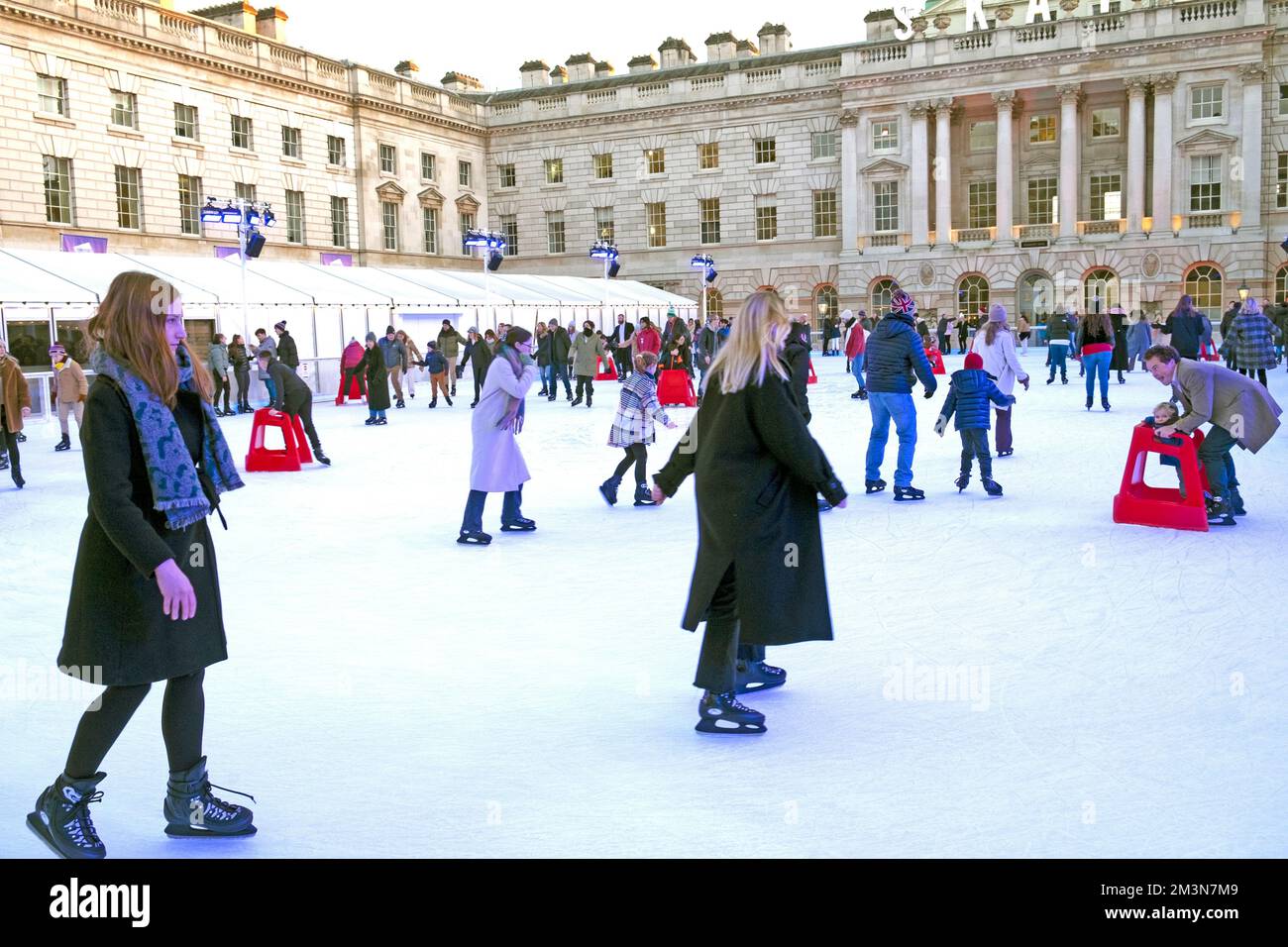 Ice skaters people ice skating on the public rink outside Somerset